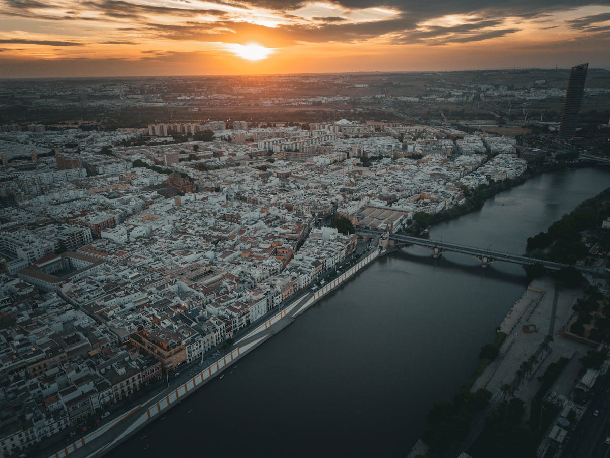 Aerial view of Seville Spain at sunset showing the city and the Guadalquivir River