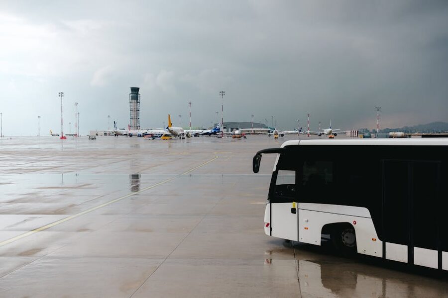 Airport tarmac passenger bus rainy day