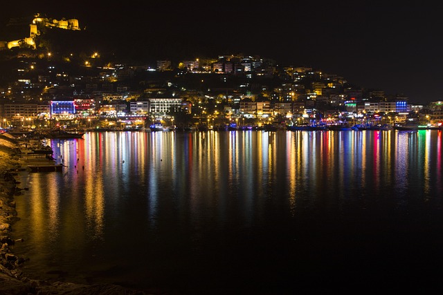 Alanya castle walls reflected in the sea at night