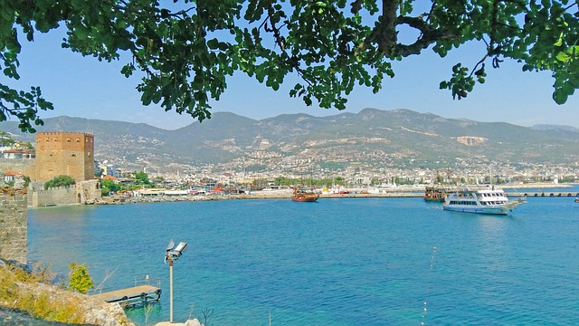 Alanya coastline with the Red Tower and castle walls above the harbour