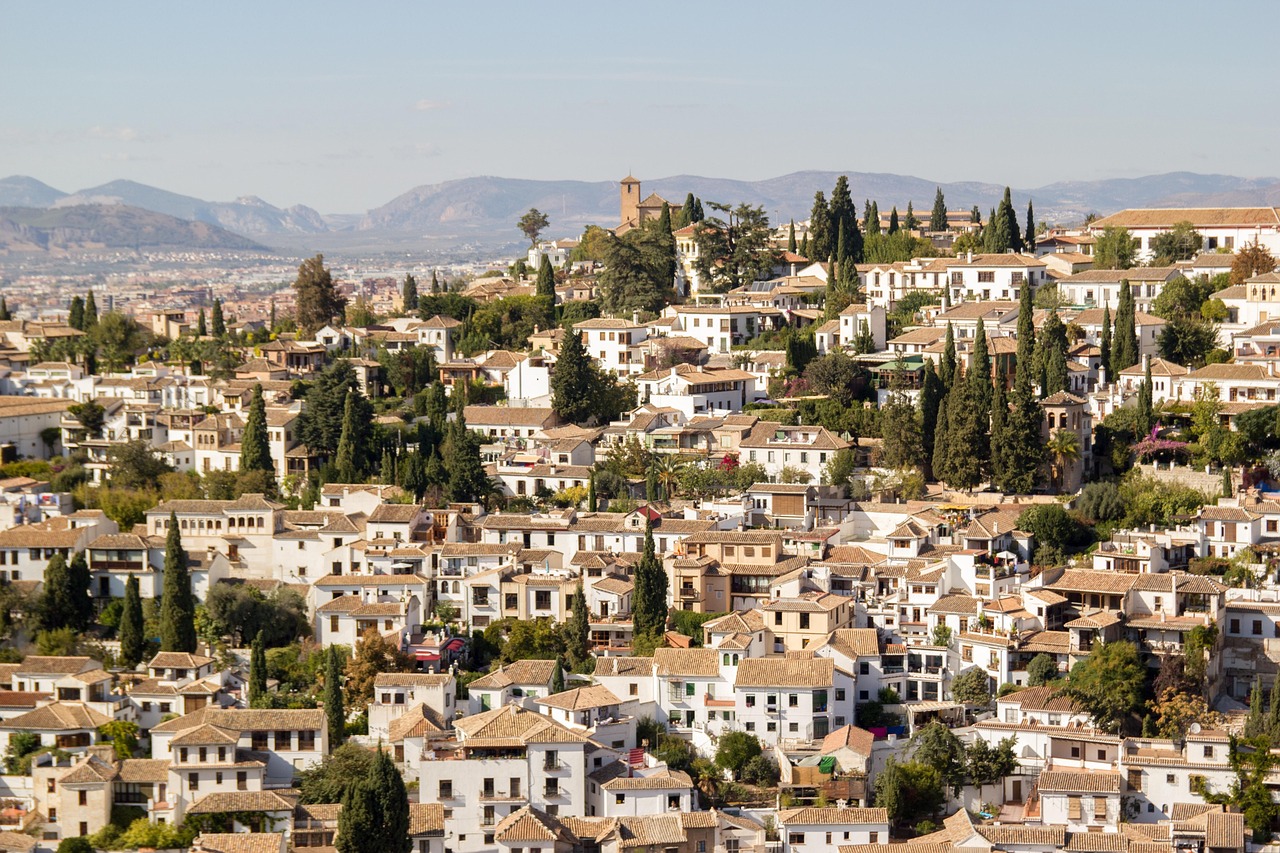 Panoramic skyline view of the Albaicin district in Granada showing rooftops and the cathedral