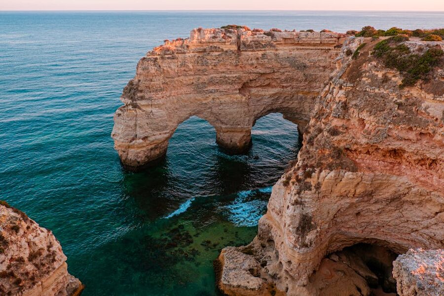 Algarve cliffs bathed in warm late-afternoon sunlight