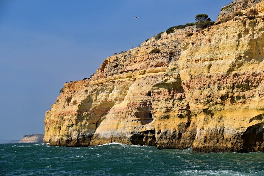 Rugged Algarve cliffs meeting the ocean in Faro District