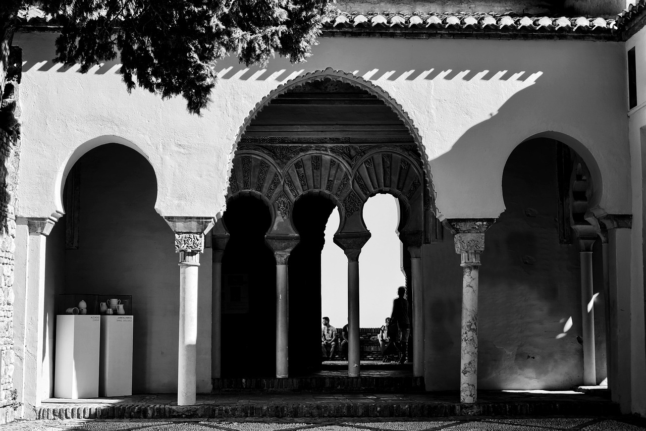 A series of horseshoe-shaped Moorish arches inside the Alcazaba fortress in Malaga showing Islamic architectural design