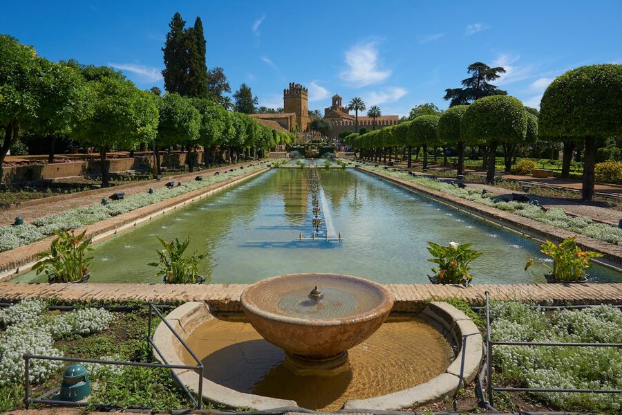 Gardens of the Alcazar de los Reyes Cristianos in Cordoba with geometric hedges and fountains