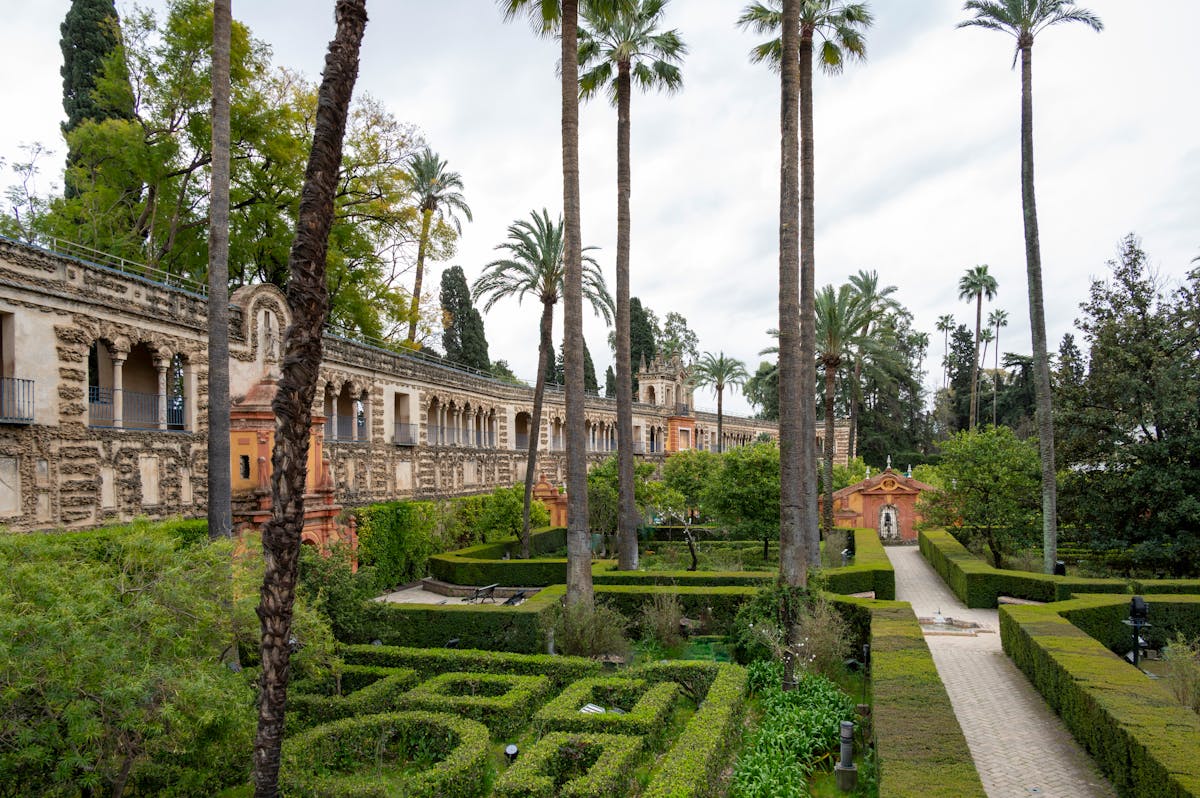 The royal gardens of the Alcazar of Seville with manicured hedges