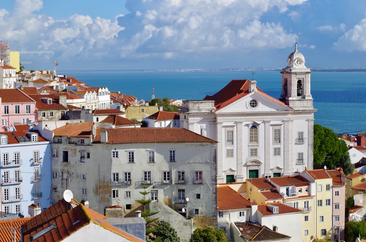 Colorful buildings in Alfama district overlooking the Tagus river
