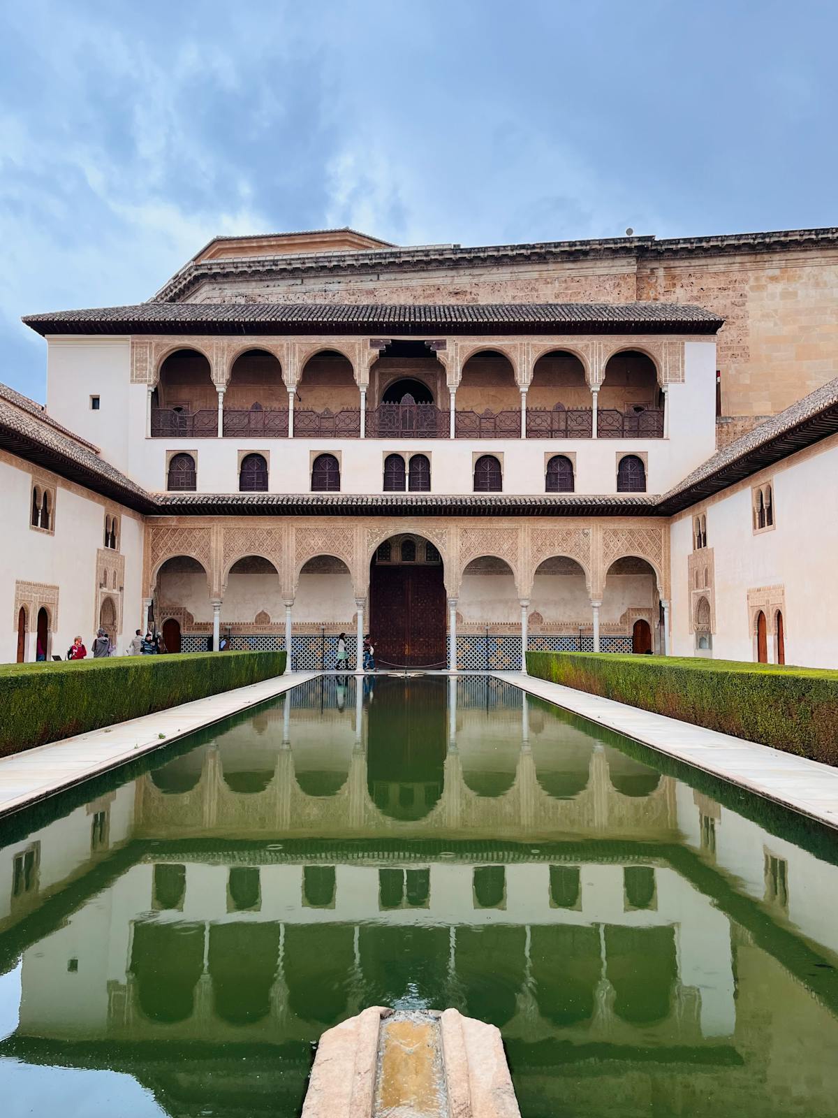 A serene reflecting pool at the Alhambra Palace in Granada