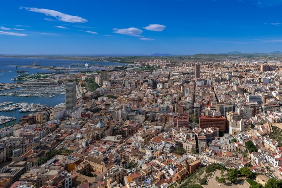 Aerial view of Alicante harbor and city skyline along the Mediterranean coast