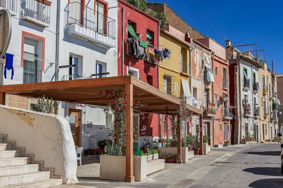 Colourful street with painted facades in the old town of Alicante Spain