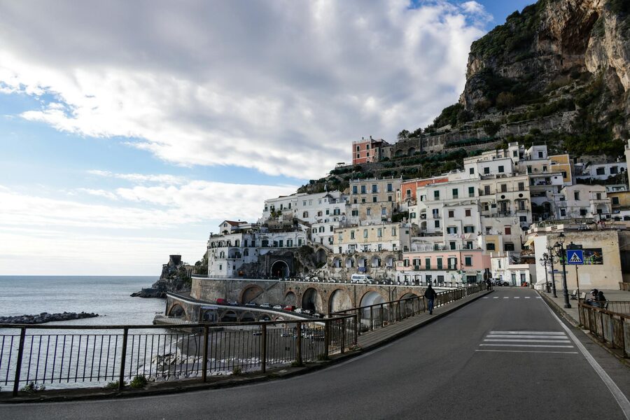 Dramatic cliffs and buildings along the Amalfi Coast stretching into the distance