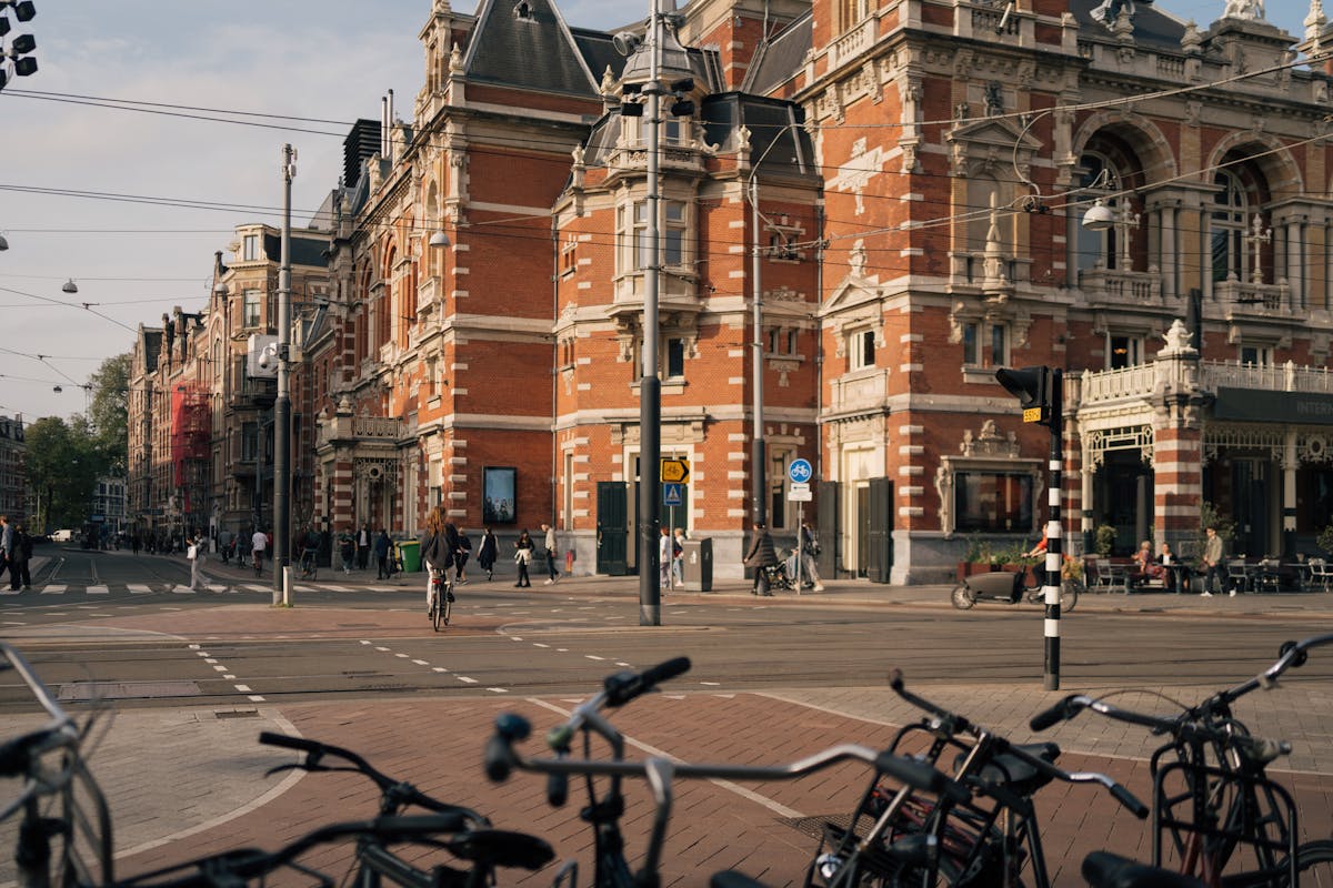 Bicycles parked in front of historic buildings in Amsterdam