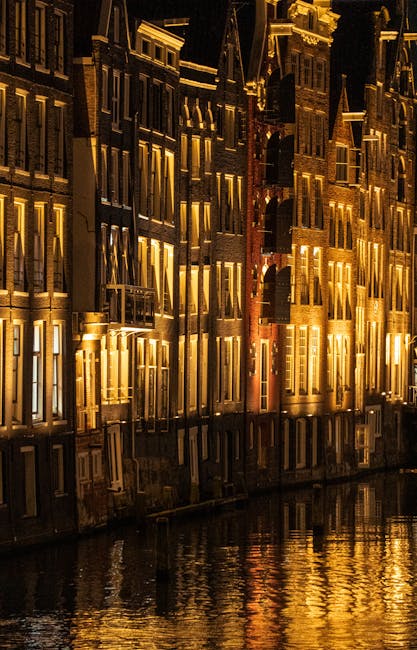 Amsterdam canal district night scene with illuminated facades
