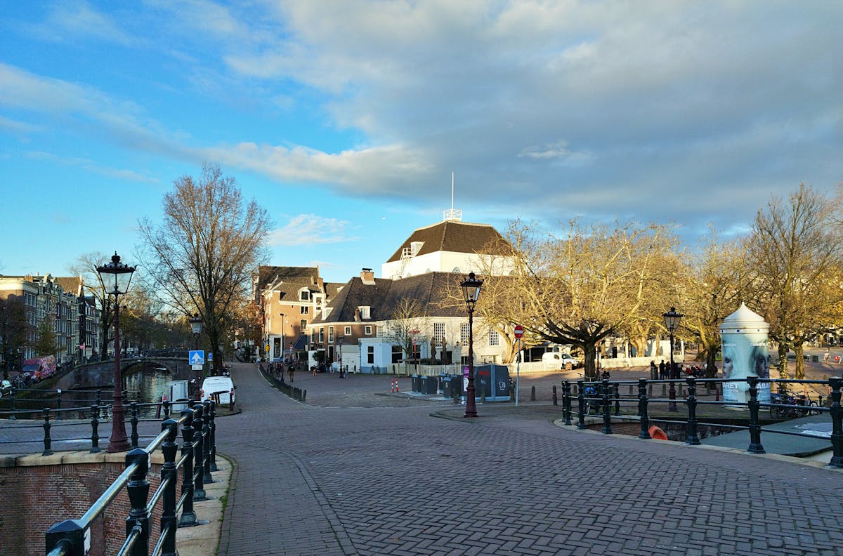 Charming Amsterdam street view with classic canal and architecture