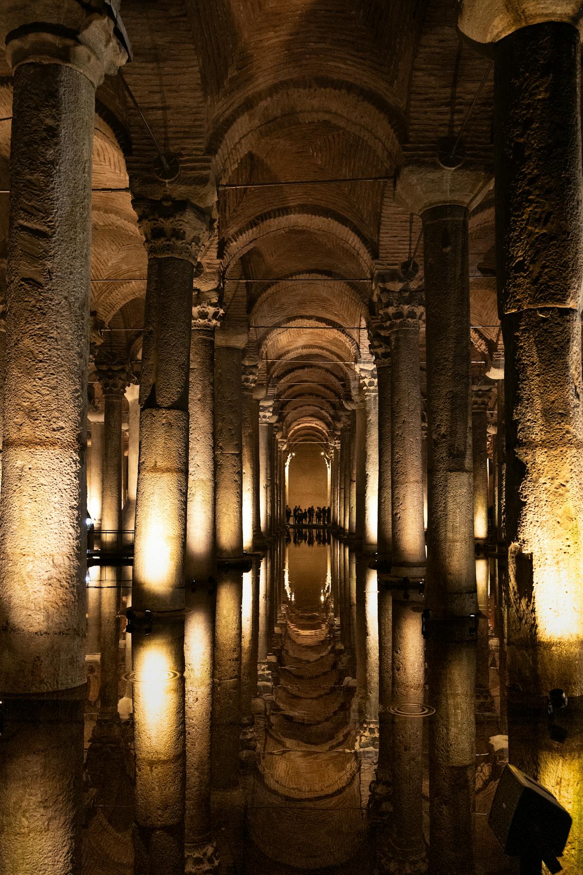 Stunning interior view of an ancient underground cistern with illuminated columns