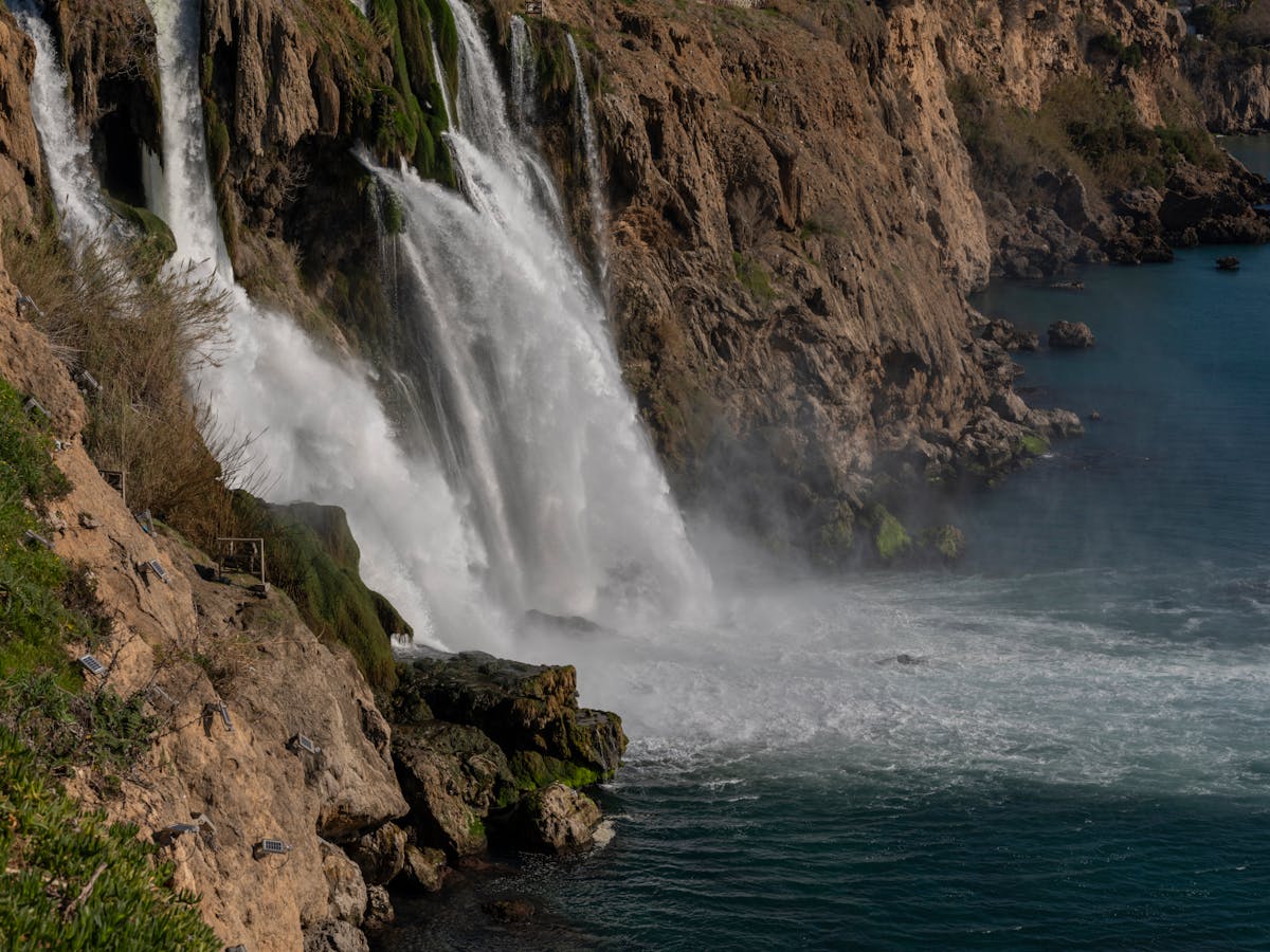 Lower Duden Waterfalls cascading into the Mediterranean from the cliffs