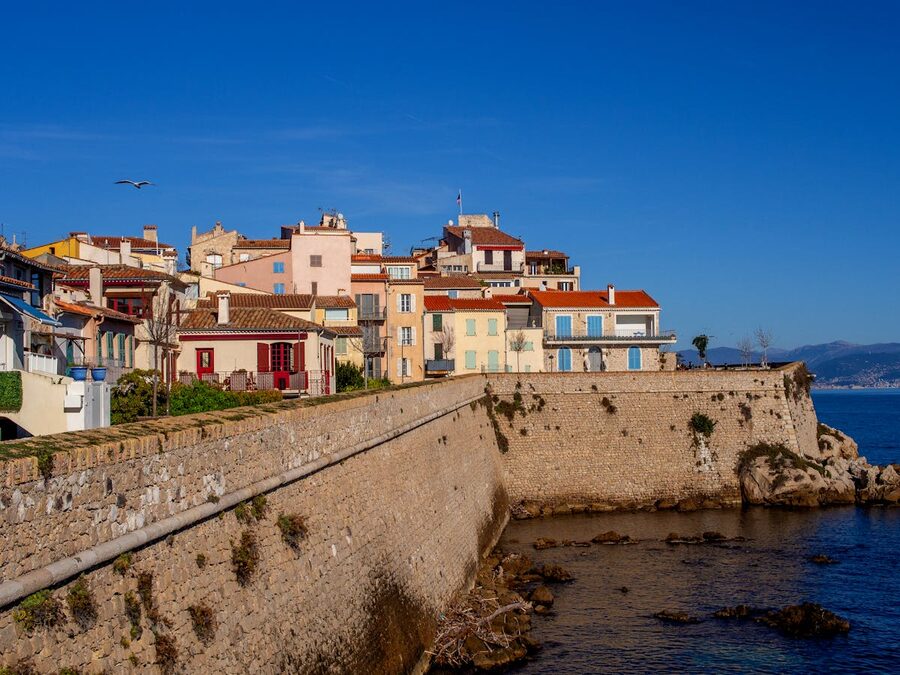 Colorful coastal buildings in the French village of Antibes on a sunny day