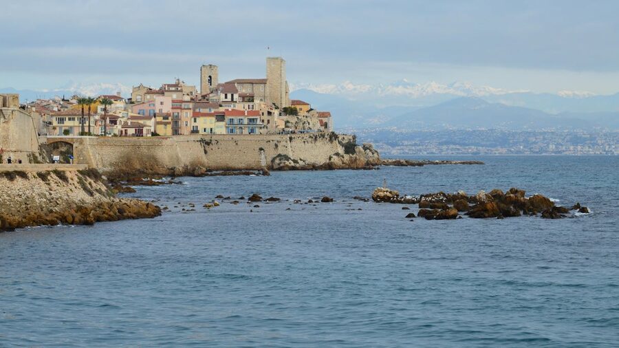 View from Antibes ramparts overlooking the Mediterranean Sea with historic architecture