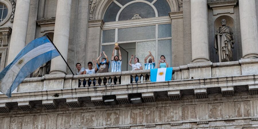Argentina fans celebrating 2022 World Cup with flags trophy