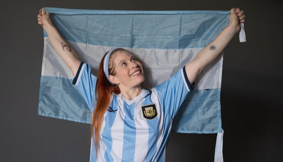 Argentina fan in national jersey holding flag