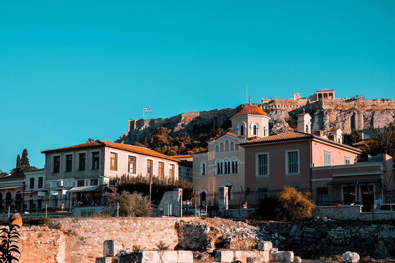 Athens street view with ancient Greek monument and neoclassical buildings