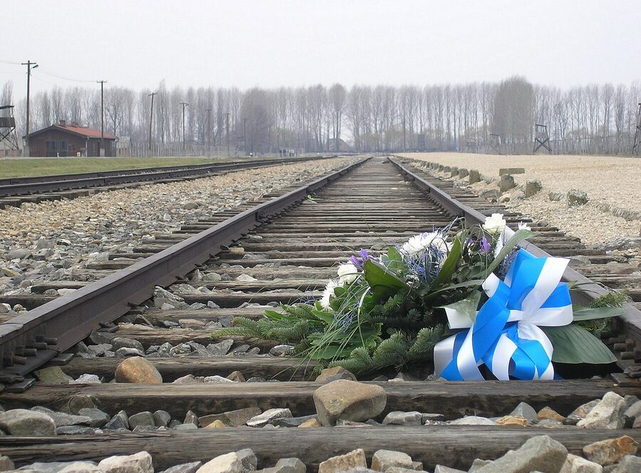 Memorial flowers placed on the Birkenau railway unloading ramp