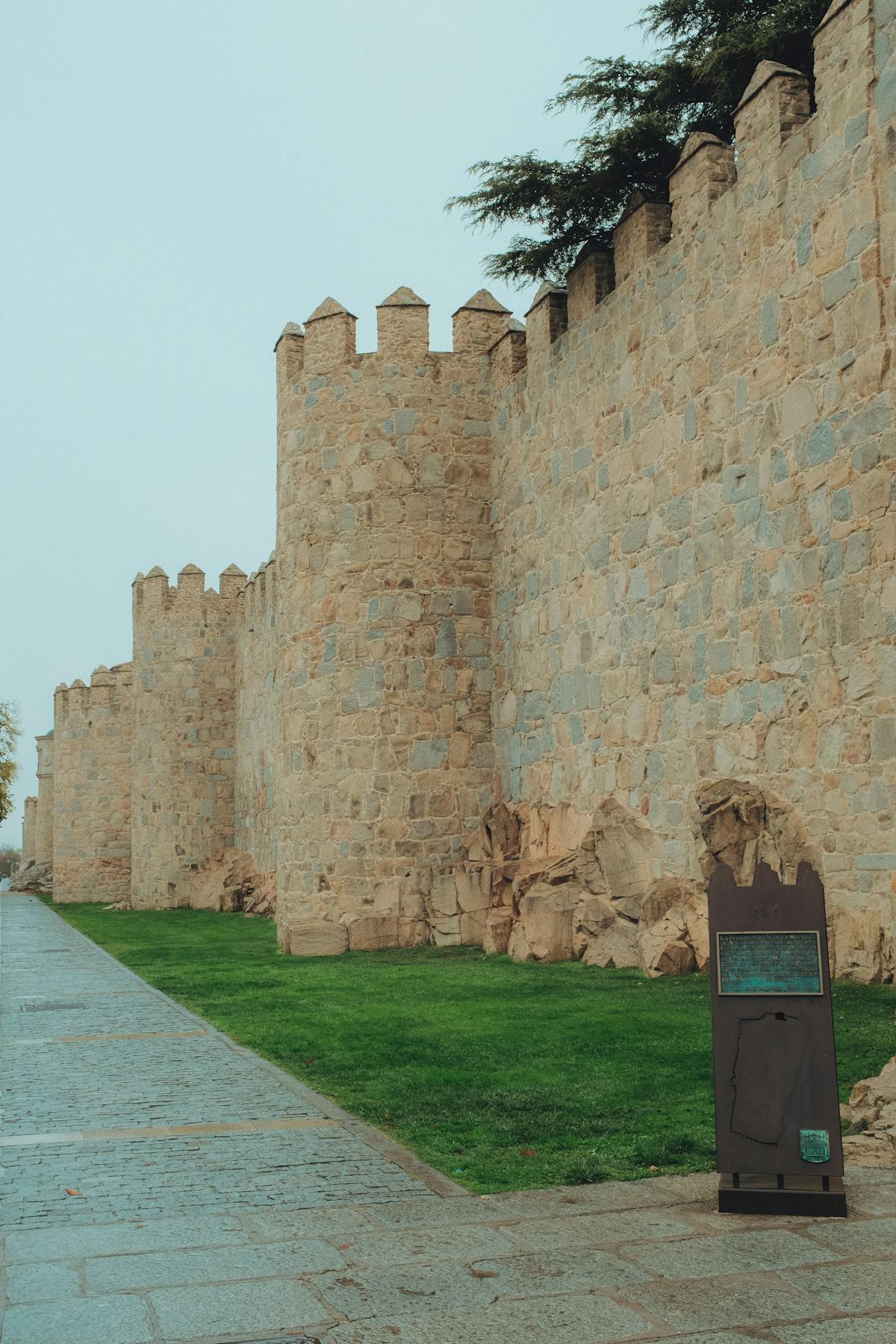 The medieval walls of Avila stretching into the distance with their distinctive round towers