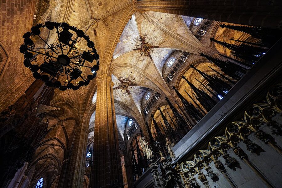 Gothic vaulted ceiling inside Barcelona Cathedral with stone arches