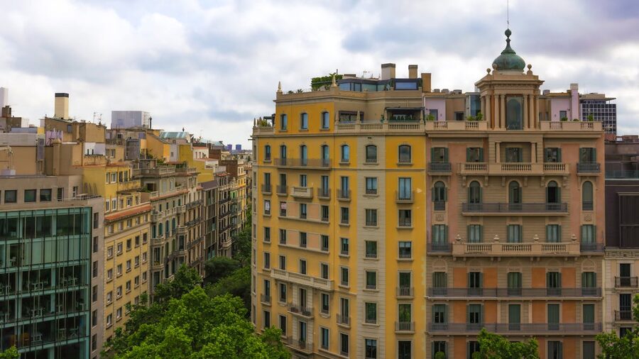 Barcelona Eixample district with colourful buildings and clouds