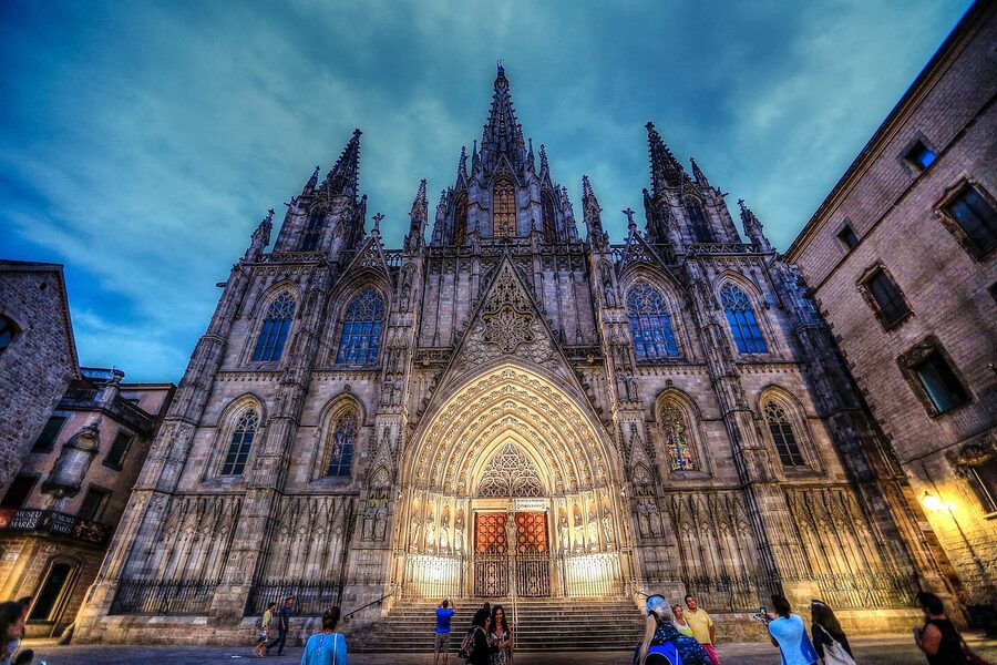 Stone archway and cathedral in Barcelona Gothic Quarter