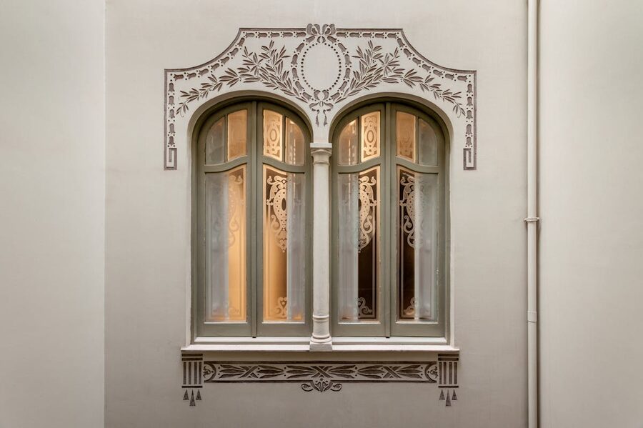 Arched windows in a modernist building facade in Barcelona