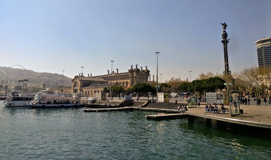 Historic buildings along Barcelona port with waterfront promenade