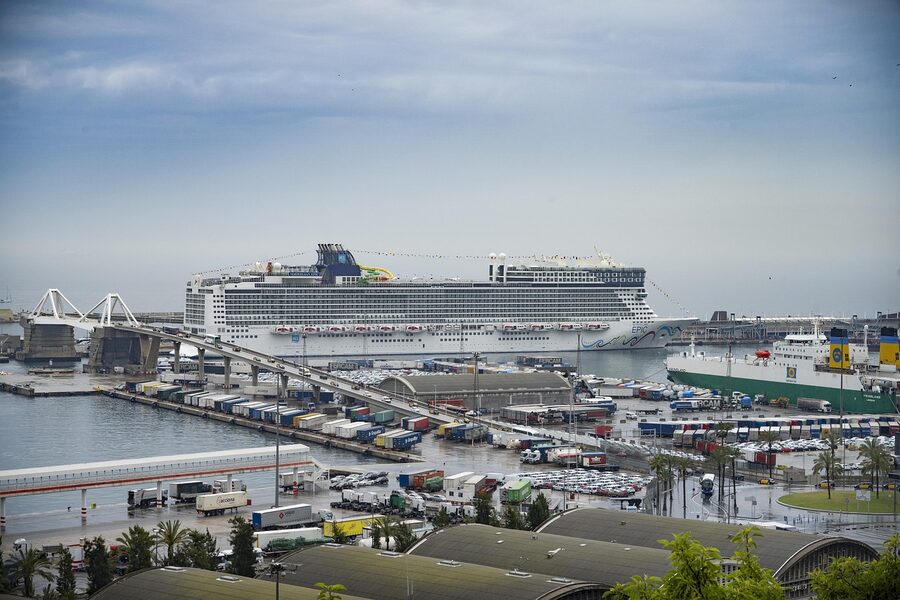 Barcelona Mediterranean port with boats and coastal cityscape
