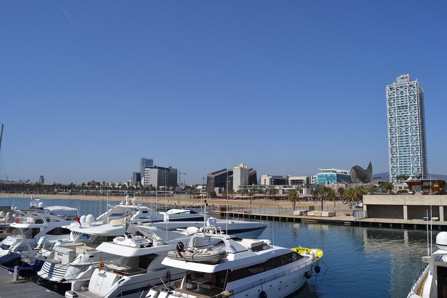 Port Olimpic marina in Barcelona with boats and Mediterranean sky