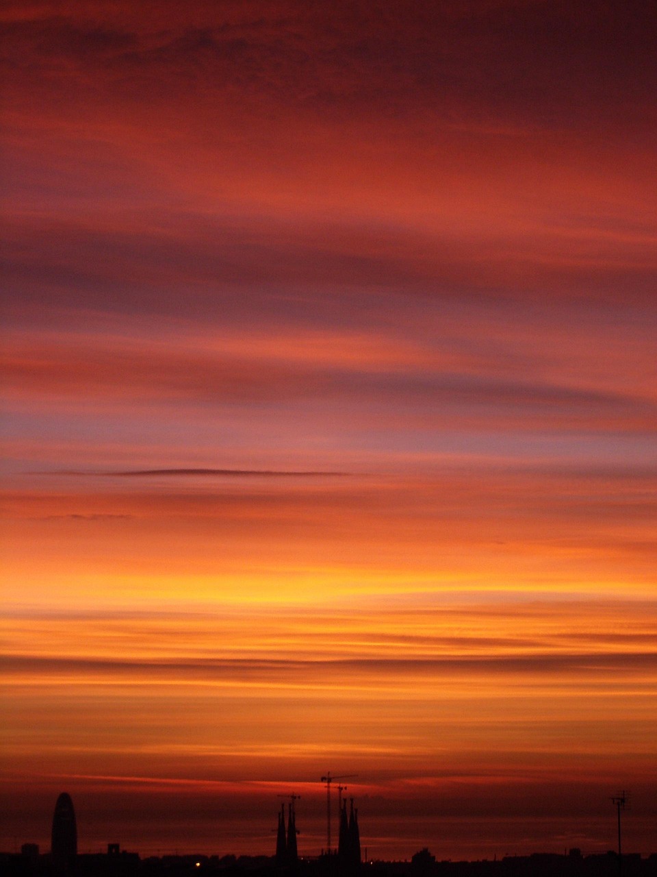 Barcelona cityscape at sunset with warm light