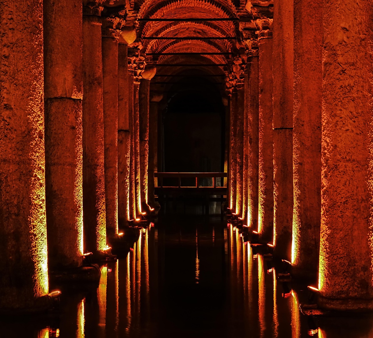 Red mood lighting inside the Basilica Cistern creating an atmospheric scene