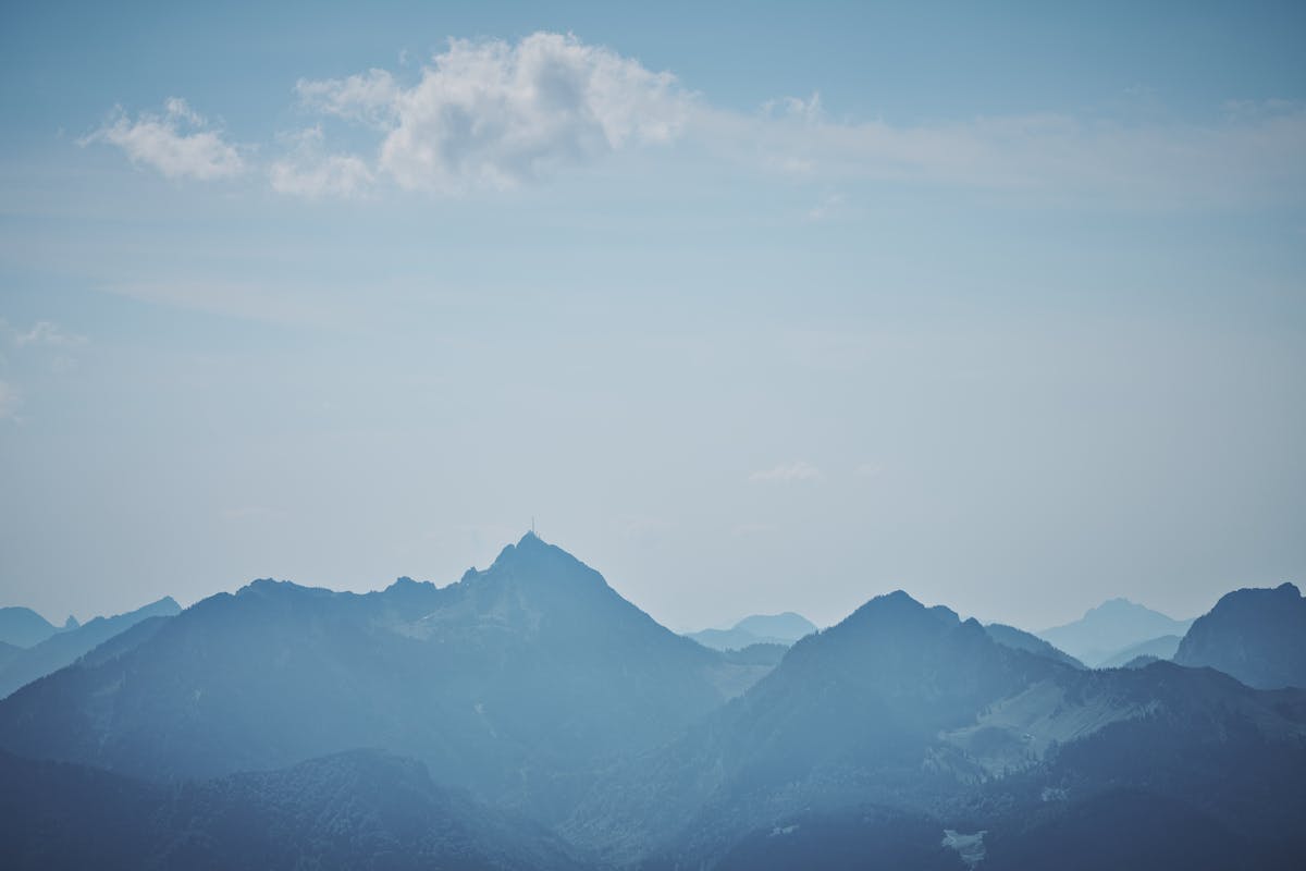 The Bavarian Alps under a clear blue sky on a bright summer afternoon