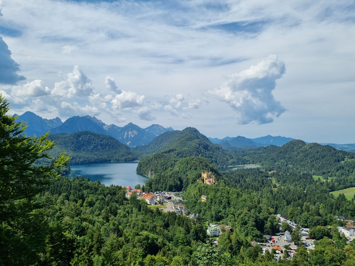 The Bavarian Alps with Alpsee lake and forested hills below Hohenschwangau Castle