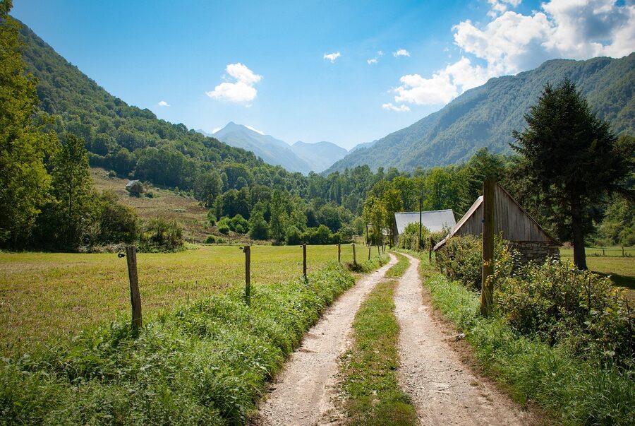 Pyrenees countryside with green meadows and mountain landscape