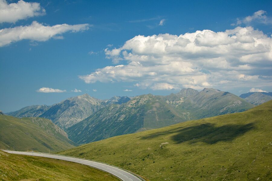 Mountain road through Pyrenees in France with green landscape