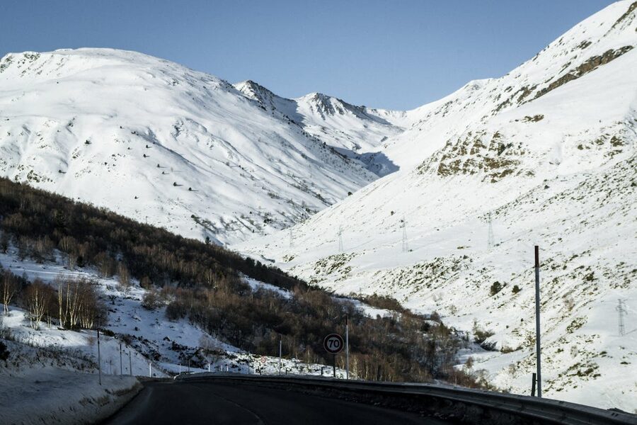 Snow-covered Pyrenees mountain road in winter