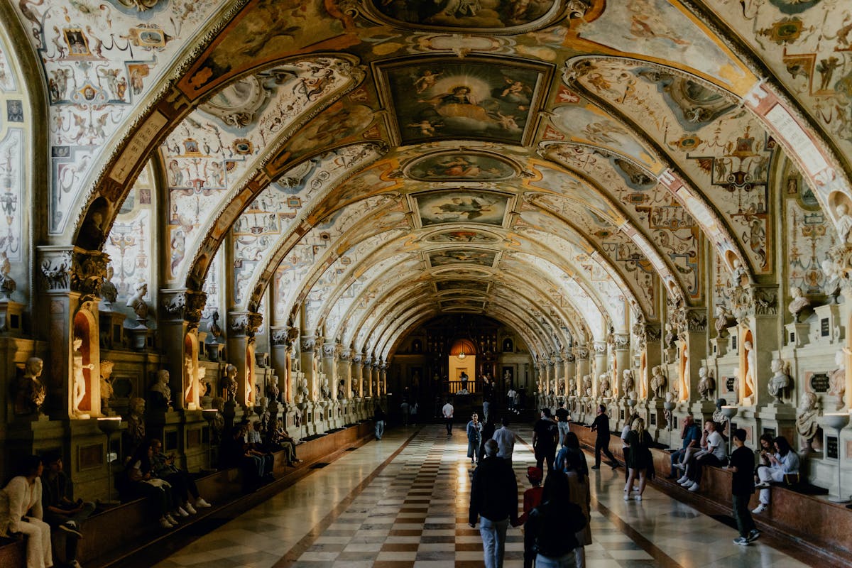 Architecture and artistic elegance of Munich Residenz gallery with visitors
