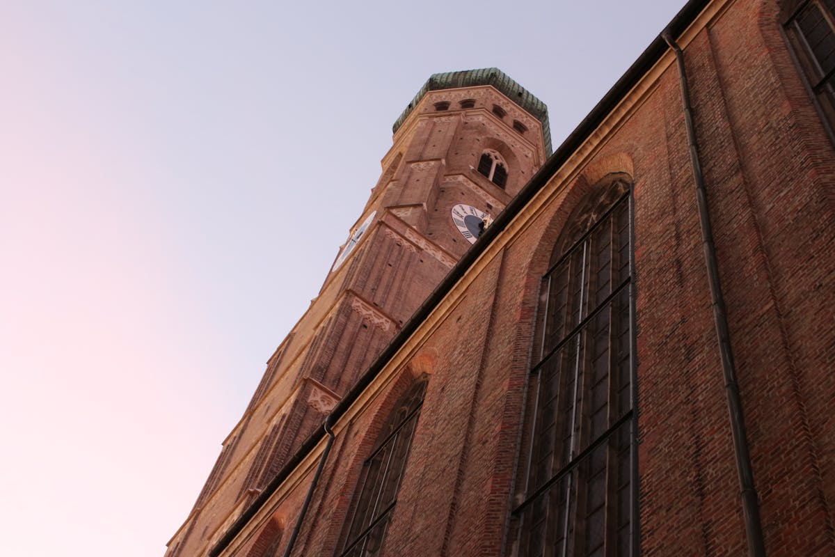 Low angle view of St Peters Church tower in Munich at dusk