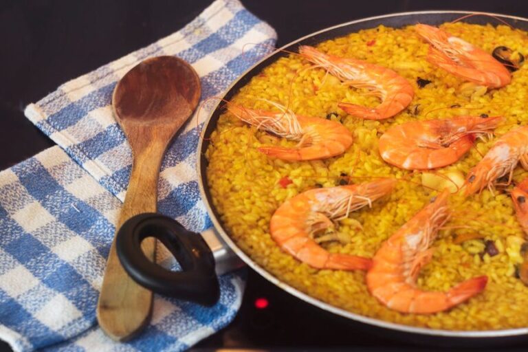 Close-up of a seafood paella with prawns in a pan