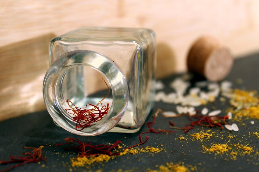 Saffron threads and rice with spices at a market stand for paella cooking