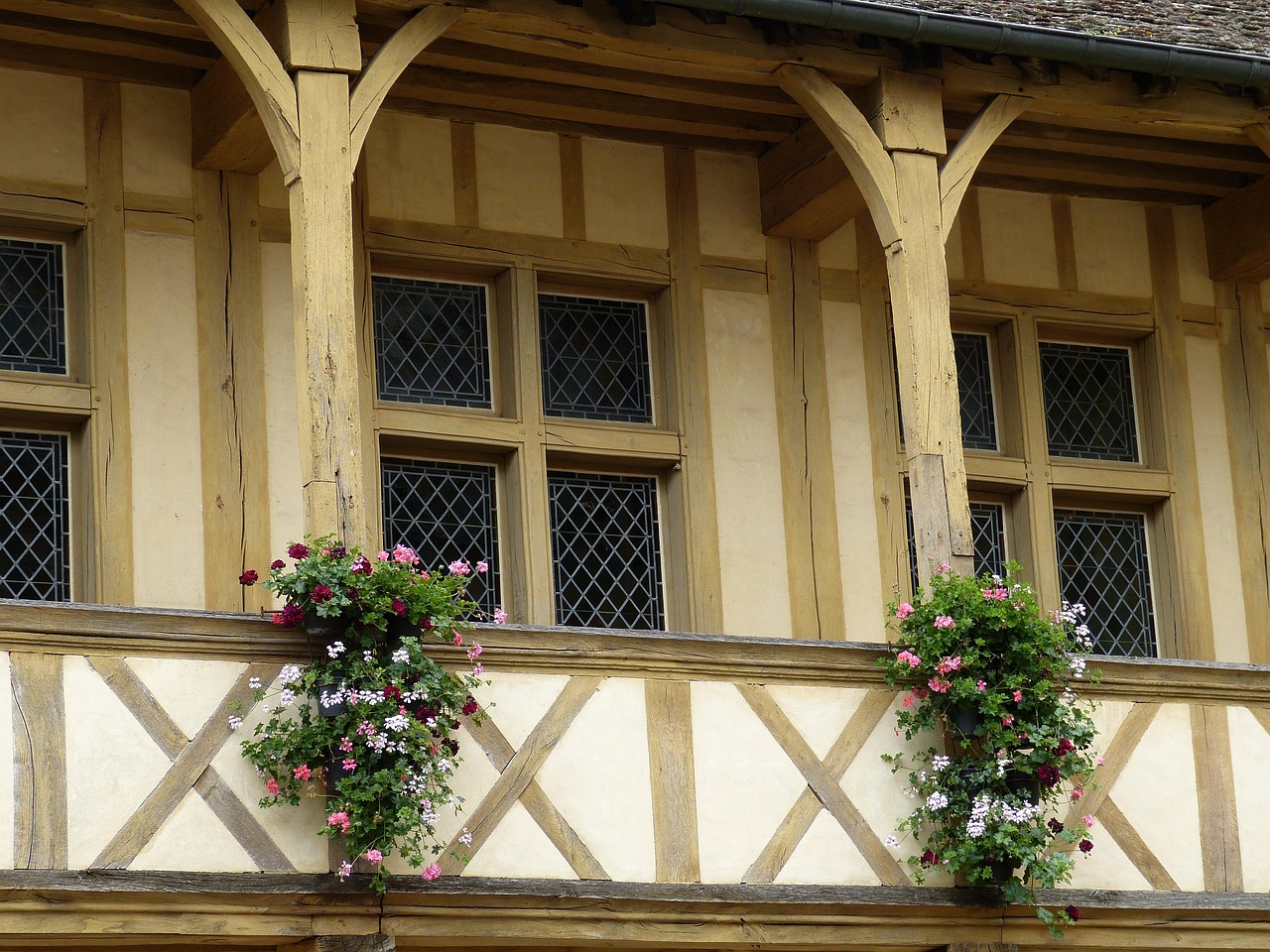 Historic half-timbered buildings with wooden balconies in the old town center of Beaune France