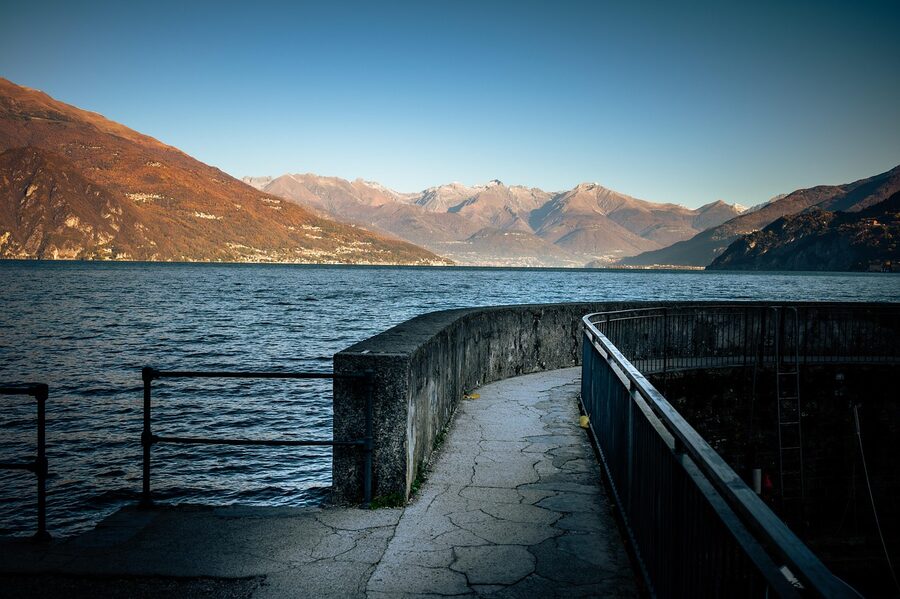 Bellagio waterfront on Lake Como with stone quay and colourful buildings