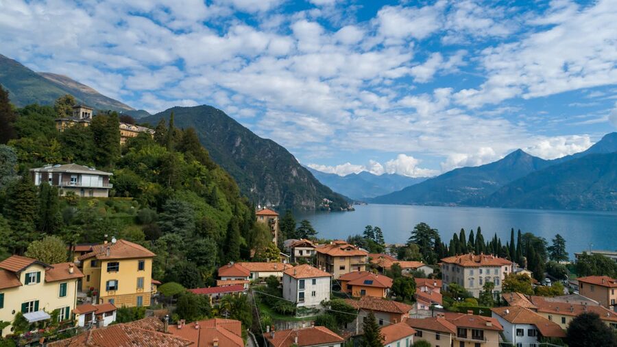 Aerial view of a charming town on the shore of Lake Como surrounded by mountains