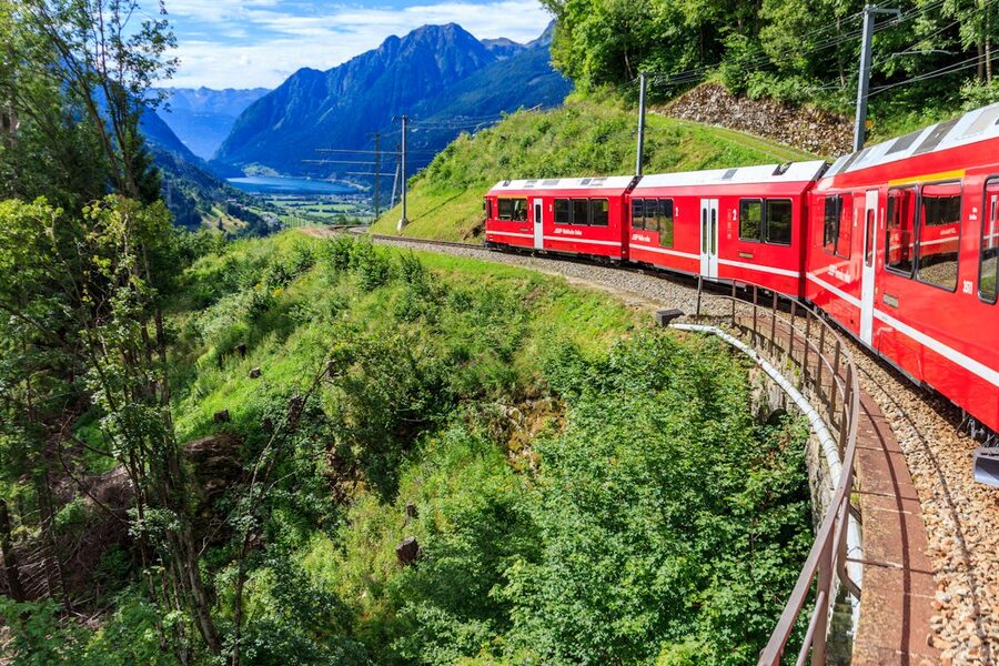 Bernina Express train curving through mountainous Swiss terrain