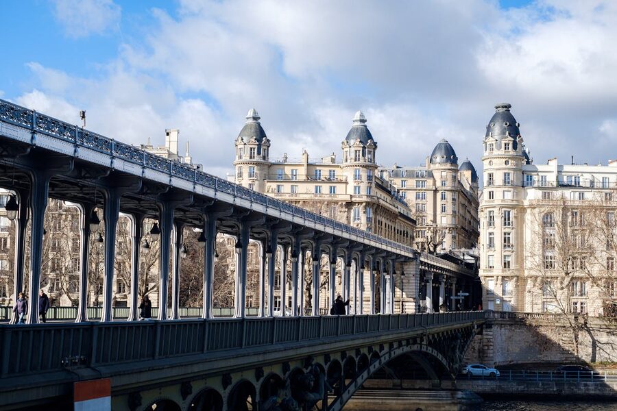 The Eiffel Tower seen from a bridge along the Seine in soft morning light